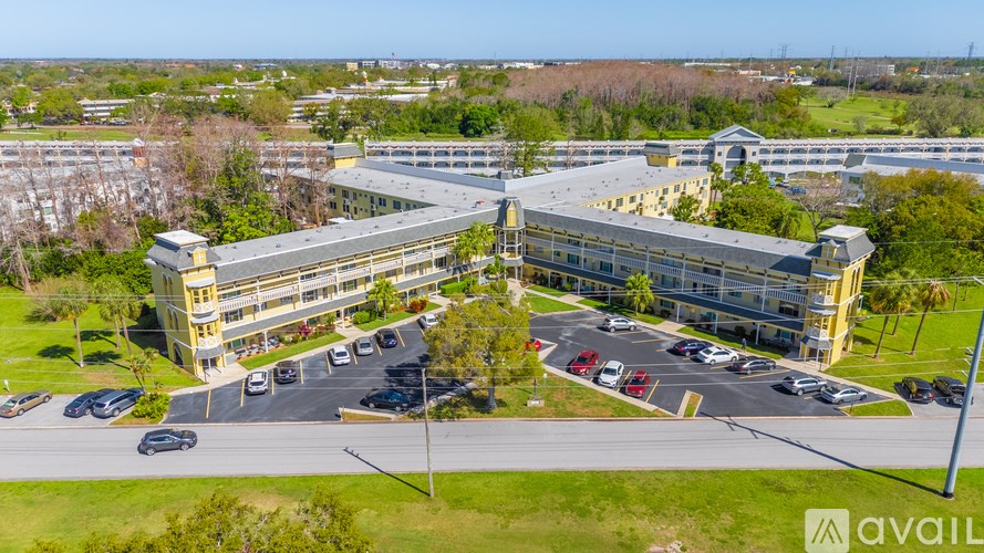 A large building with a parking lot in front of it.