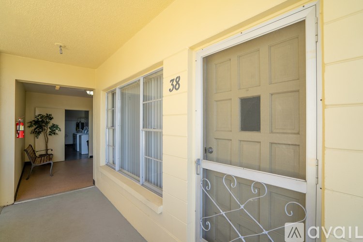 A white door with a number 38 on it is closed.