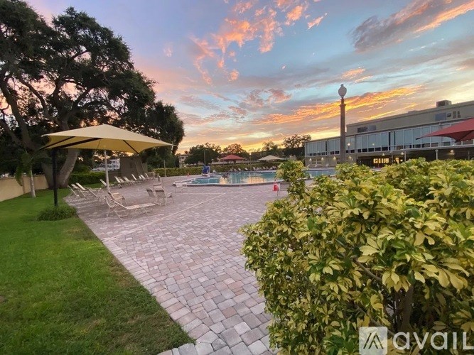 A patio area with a table and chairs is set up for outdoor dining.