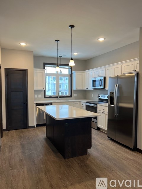 A modern kitchen with a large island in the middle.