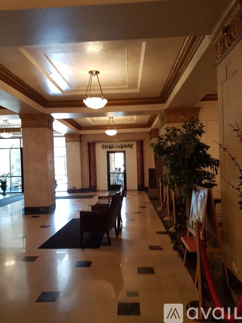 A long hallway with a red carpet and a sign that says "CHAIR-HUMANS".