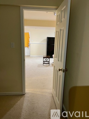A room with a television and a chair in it.