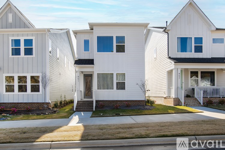 A row of houses with the middle one being the most prominent.