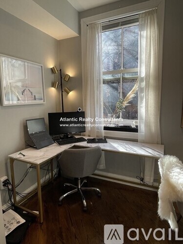 A bedroom with a bed, dresser, and a television.