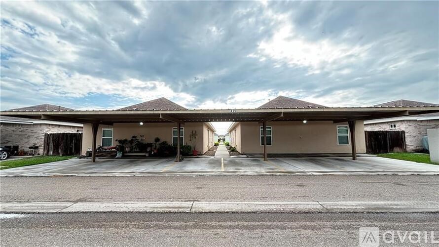 A large house with a driveway in front of it.