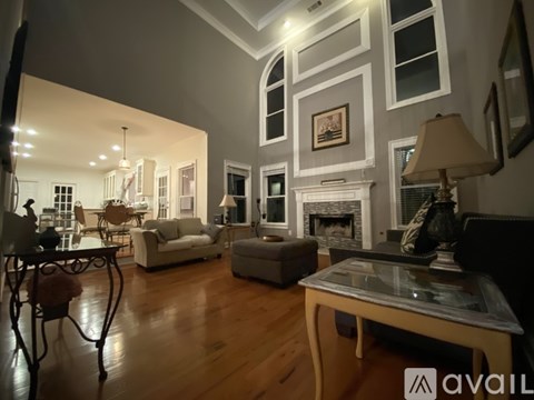 A dining room with a wooden table and chairs.