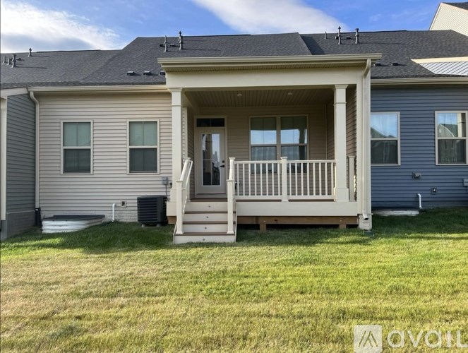 A house with a porch and a covered entrance.
