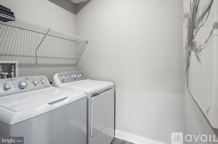 A laundry room with a washer and dryer.