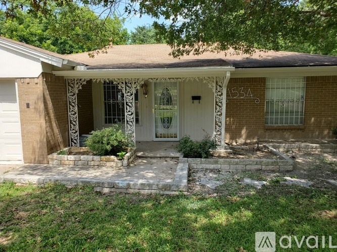 A house numbered 534 with a white door and window.