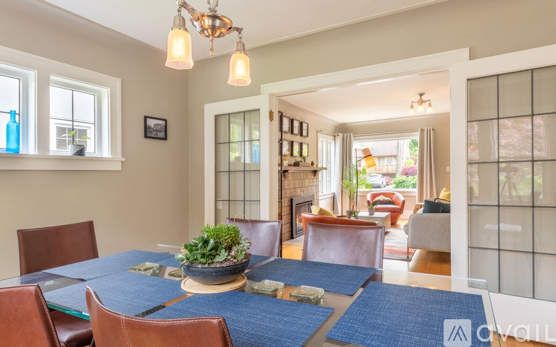 A dining room with a table set for four.