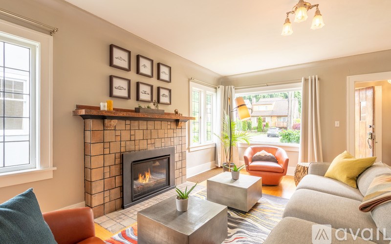 A living room with a fireplace and a couch.