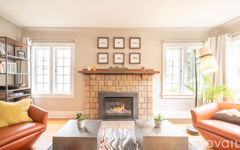 A living room with a fireplace and a couch.