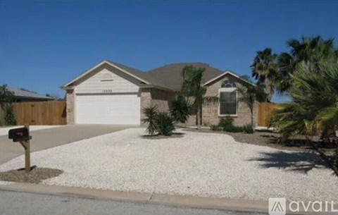 A house with a white garage door is for sale.