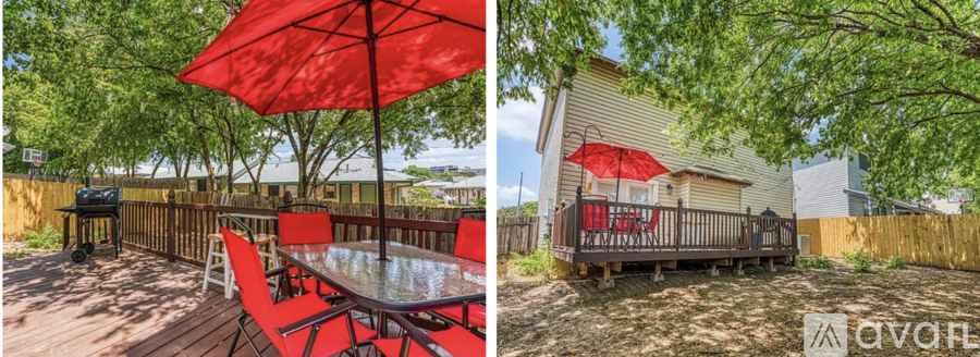A patio with a table and chairs under a red umbrella.