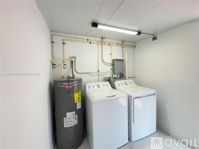 A laundry room with a washer and dryer.