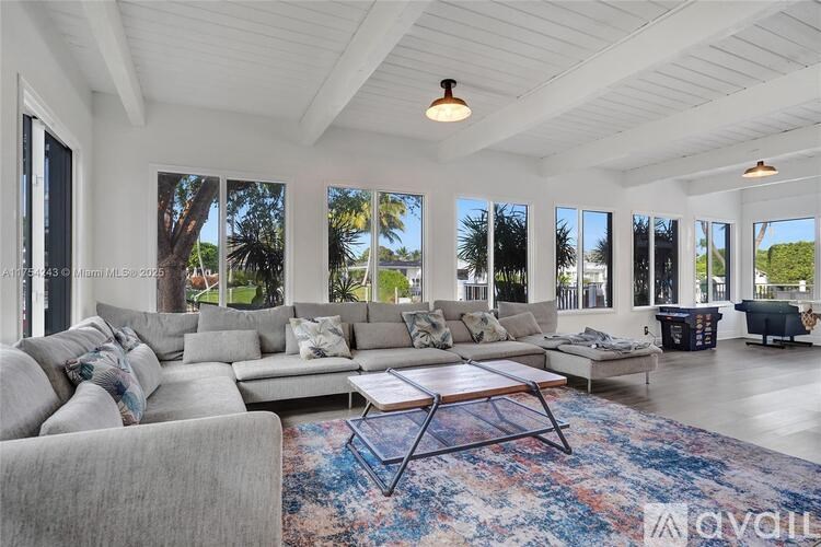 A living room with a grey sofa and a coffee table.