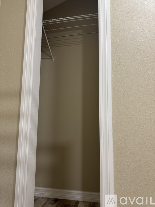 A white door with a glass window is open.