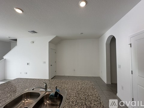 A kitchen with a sink and a countertop.