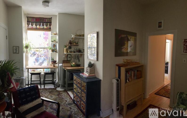 A living room with a chair and a table.