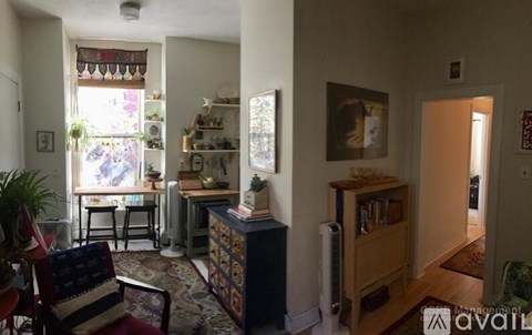 A living room with a chair and a table.