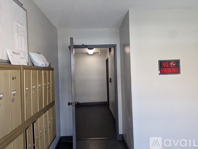 A hallway with a no smoking sign on the wall.