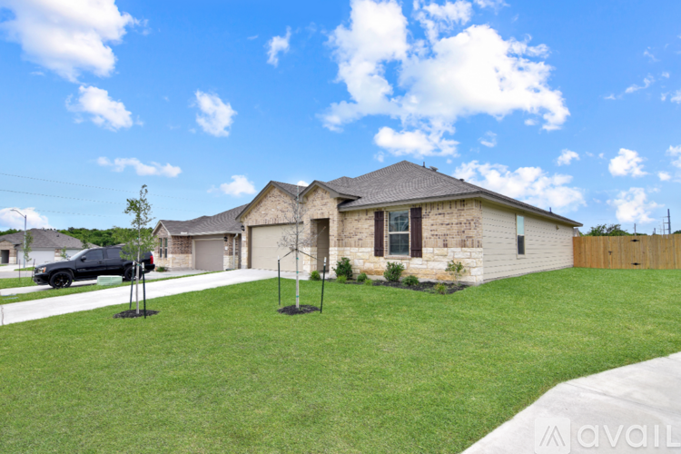 A house with a brown roof and a white garage door.
