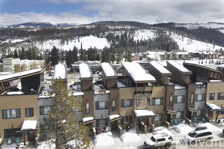 A view of a snowy mountain range from a high vantage point.