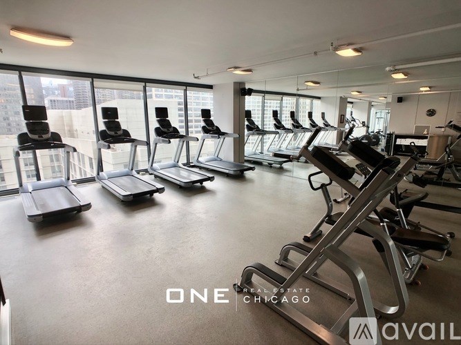 A gym with treadmills and elliptical machines.