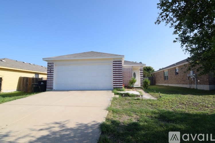 A house with a striped facade and a garage door.