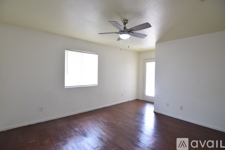 A bathroom with a toilet, sink, and shower.