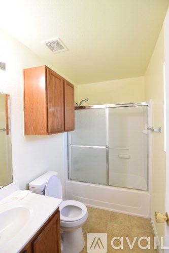 A kitchen with a stainless steel refrigerator, microwave, oven, and dishwasher.