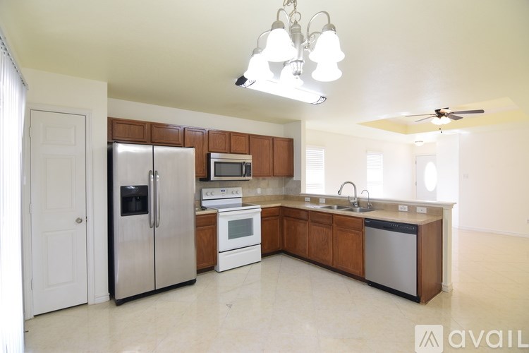A room with a ceiling fan and tiled flooring.