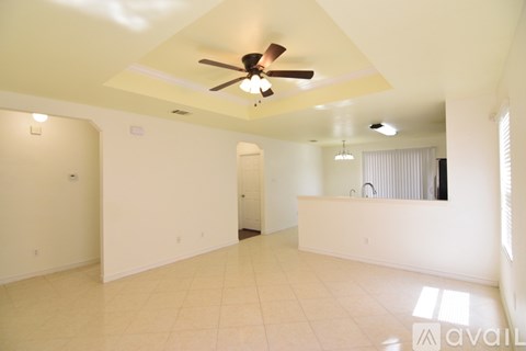 A kitchen with a refrigerator, microwave, oven, sink and cabinets.
