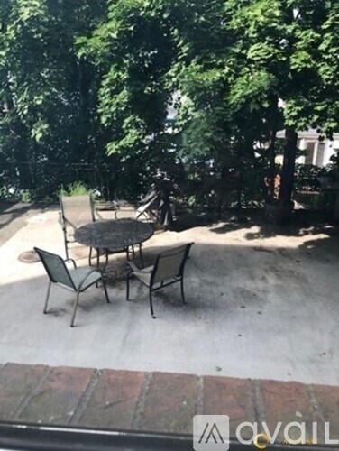 A table and chairs are set up on a patio.