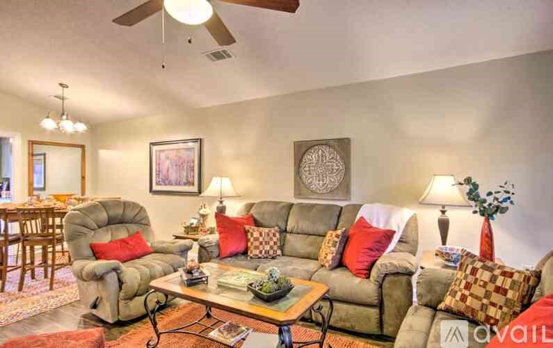 A living room with a grey sofa and a coffee table.