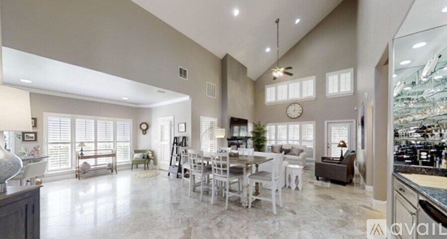 A spacious kitchen and dining area with a large island in the middle.