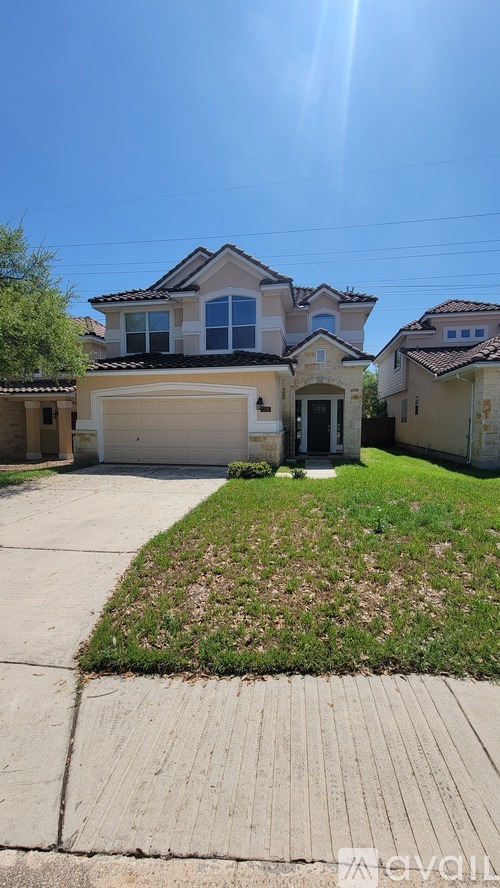 A house with a driveway in front of it.