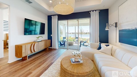 A modern living room with a white sofa and a wooden coffee table.