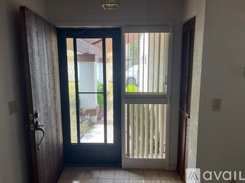 A view of a patio through a sliding glass door.