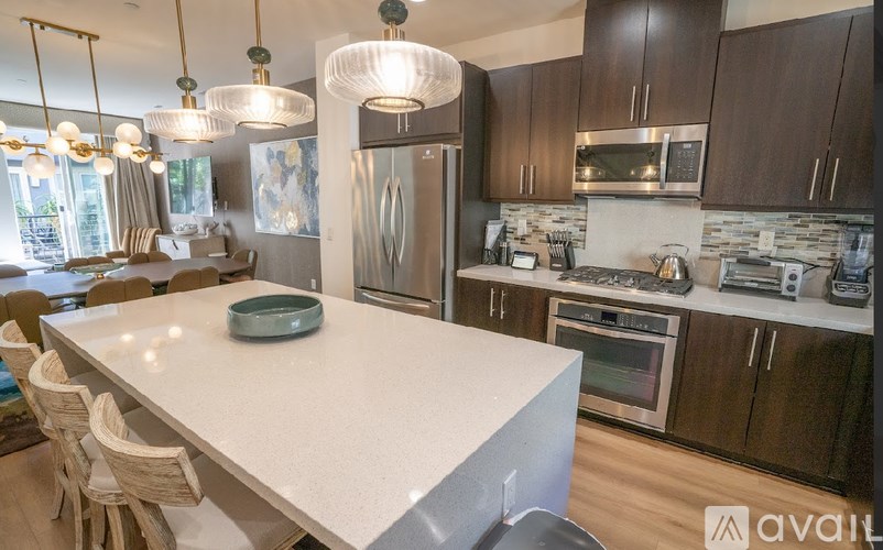 A modern kitchen with a large island in the center.