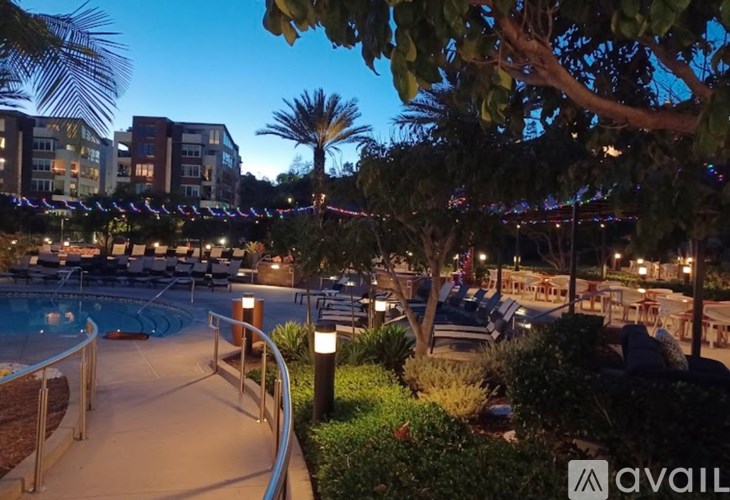 A pool area with a lit up sign that says "available" in the foreground.