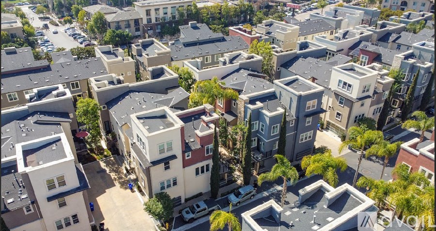 A bird's eye view of a residential area with multiple houses.