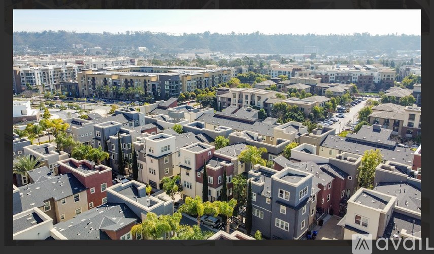 A bird's eye view of a residential area with houses and buildings.