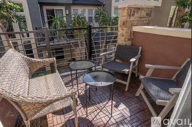 A patio with a table and chairs.