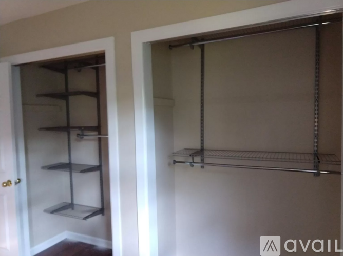 A white door with a shelf underneath it.