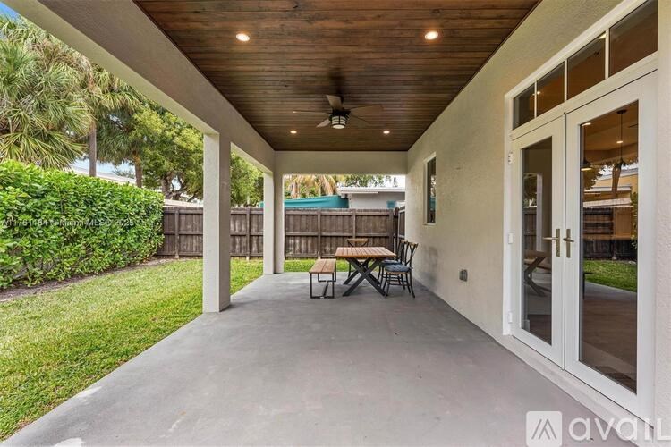 A patio with a table and chairs is available for rent.