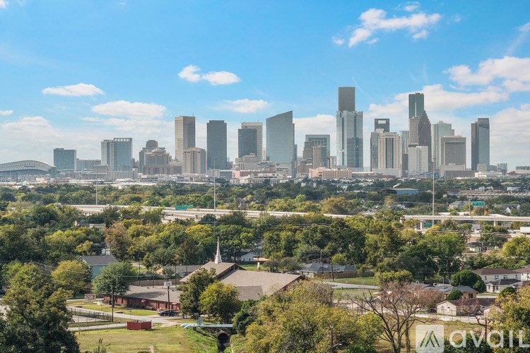 A bathroom with a toilet, sink, and mirror.