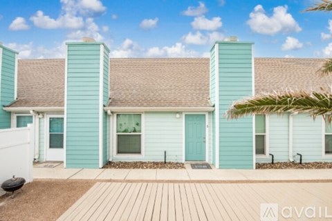 A house with a blue exterior and a brown roof is available for purchase.