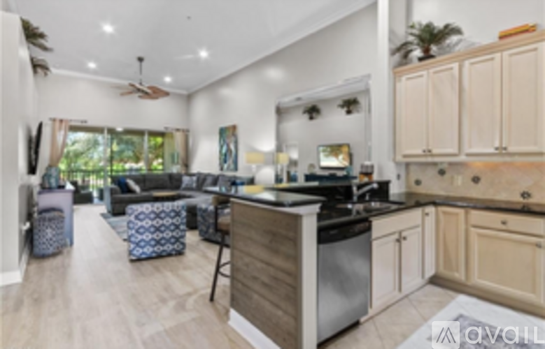 A kitchen with wooden cabinets and a black stove top oven.