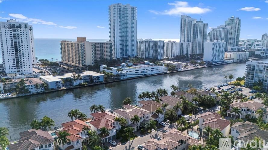 A cityscape with a river running through it.